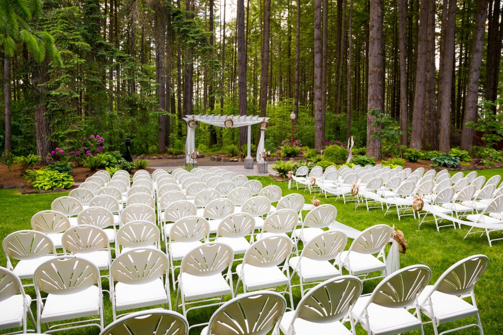 Wedding venue in Oregon has natural trees and beautiful guest seating amidst tall trees.